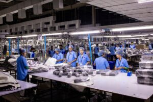 New Balance Schedules Nine Made in USA Drops for Fall 2026 Close-up of sneakers being assembled on a production line in a domestic factory