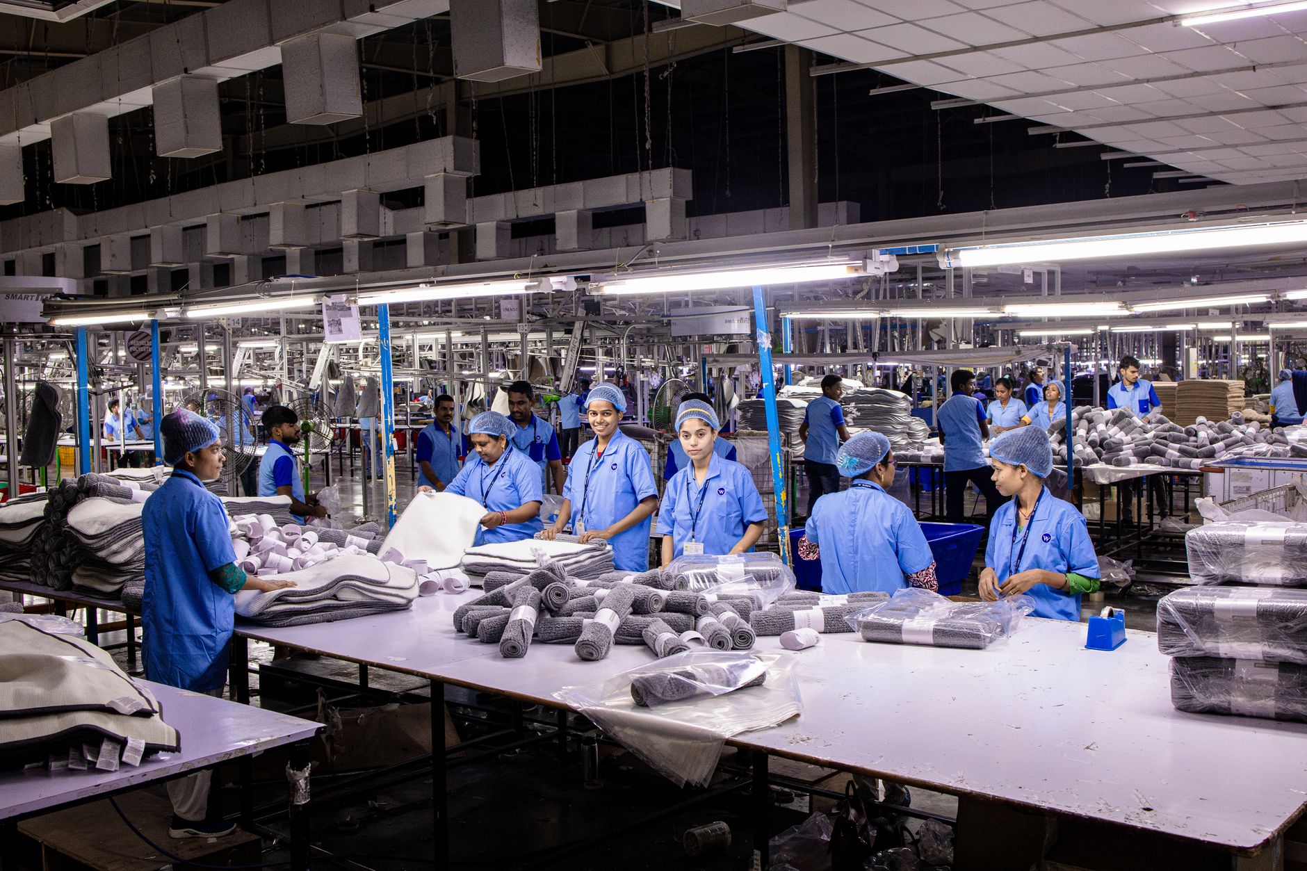 Close-up of sneakers being assembled on a production line in a domestic factory
