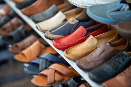 Jimmy Choo Moves Into Casual Footwear as Capri Posts 10.5% Revenue Gain Elegant luxury footwear displayed on shelves inside a high-end shoe boutique