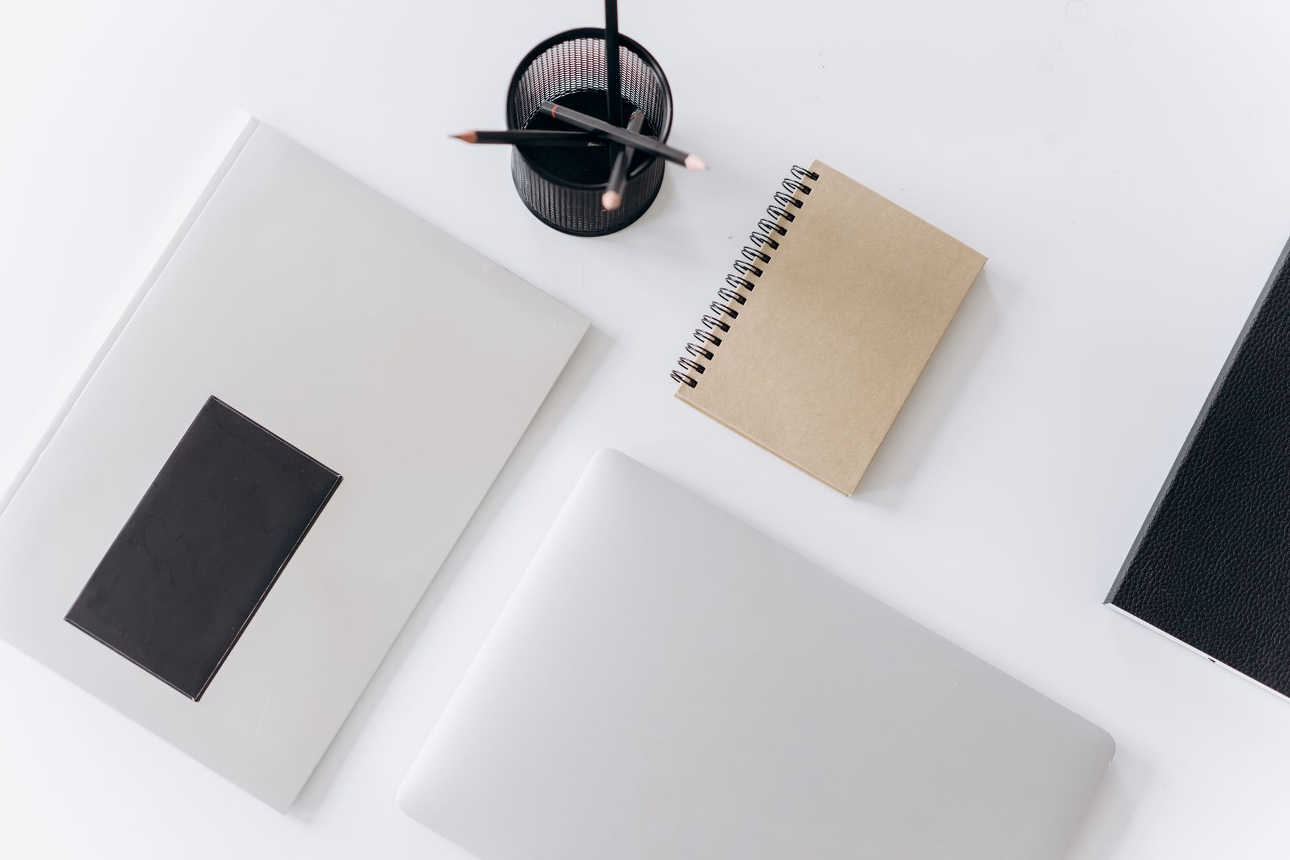 Clean organized desk with notebook, pen, and plant representing Virgo Season order