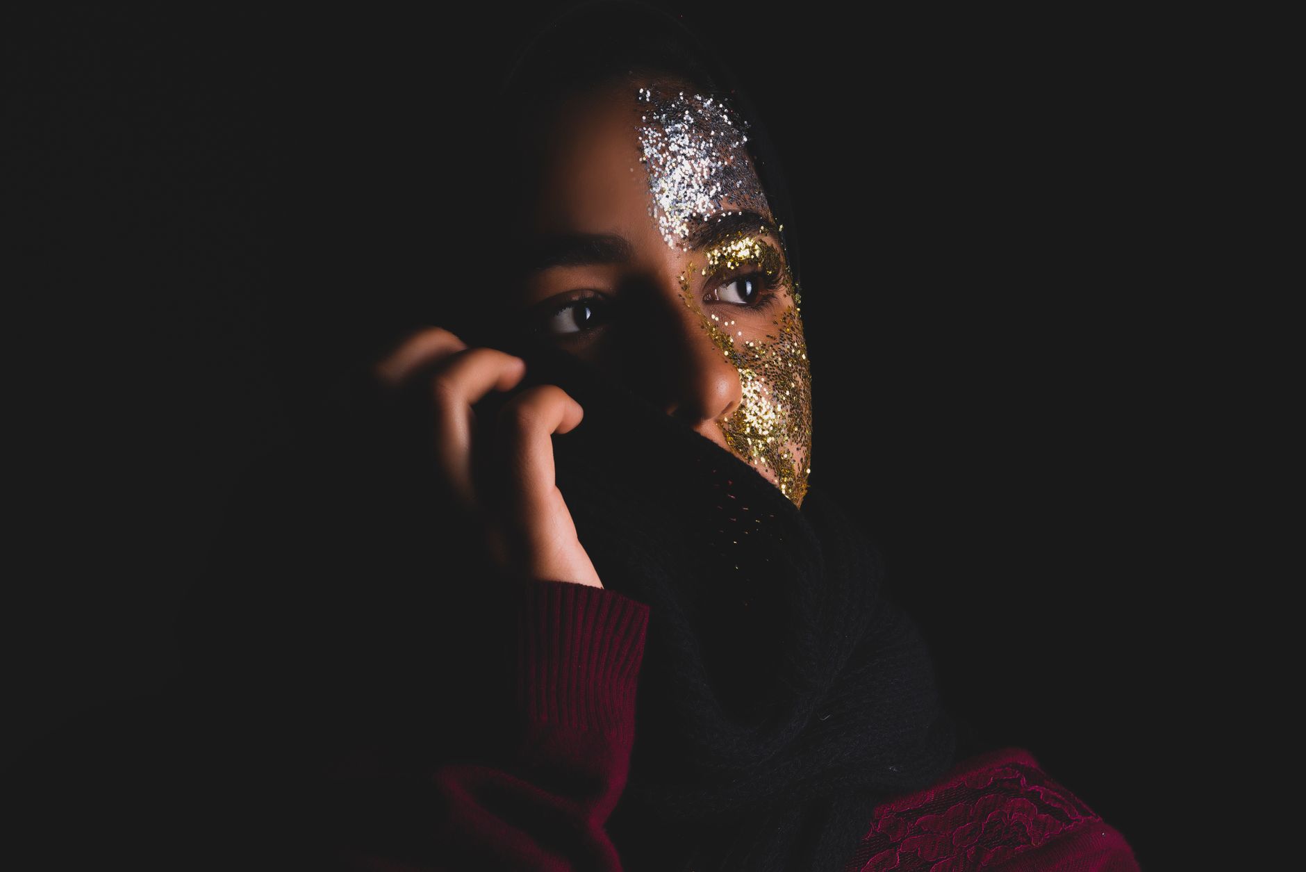 Model wearing soft glitter and sparkle makeup with cool blue tones