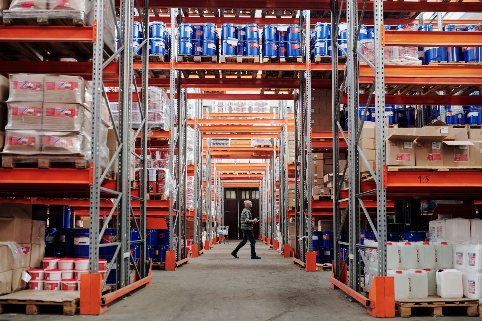 Workers organizing shoeboxes in a modern fulfillment warehouse