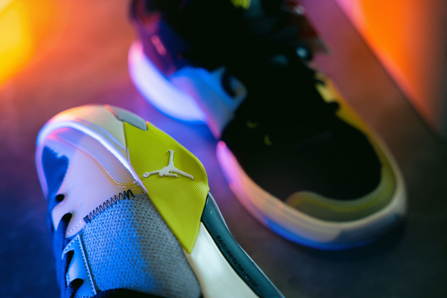 Limited edition athletic shoes displayed on a minimalist shelf