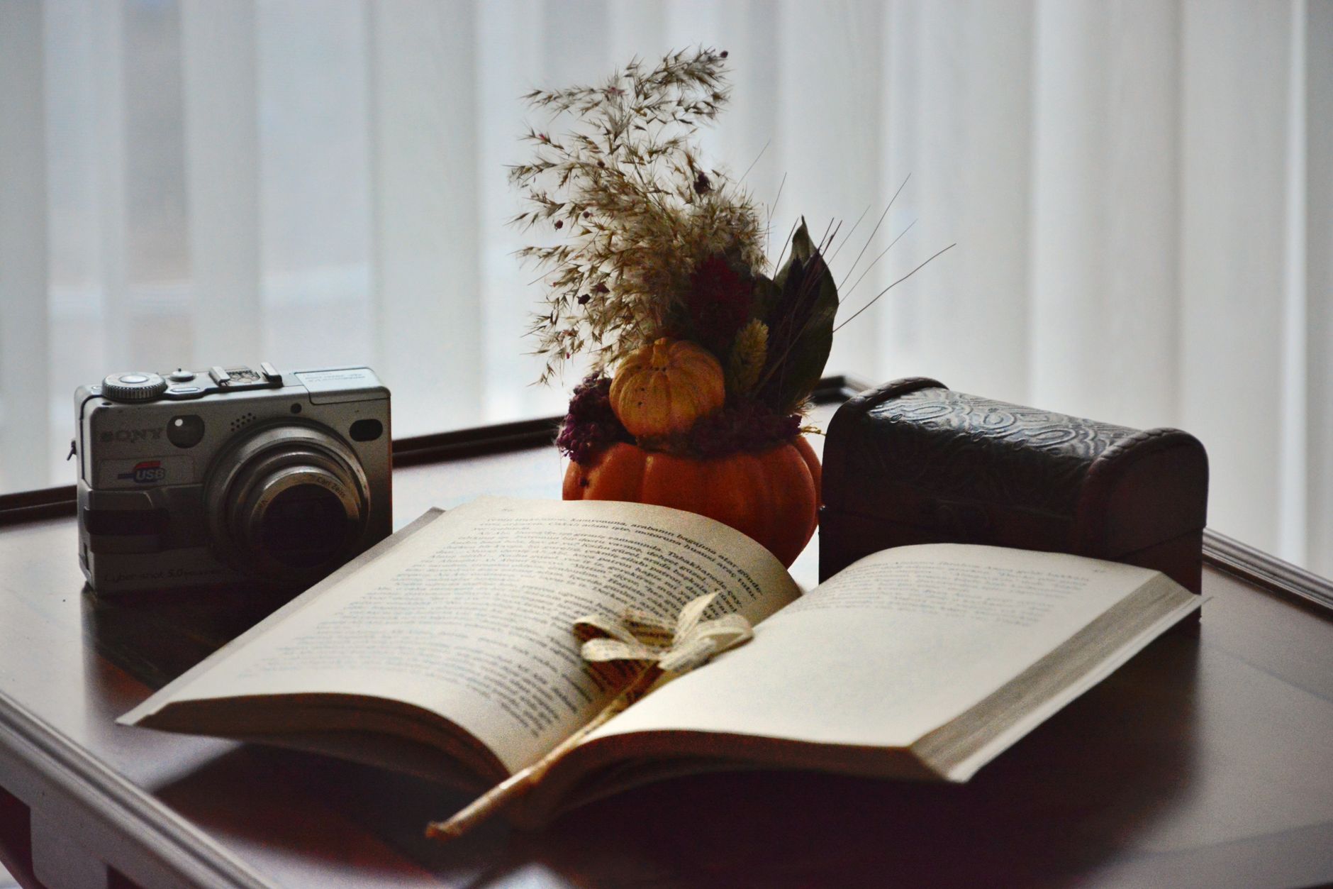 A cozy fall interior with warm lighting and soft textures