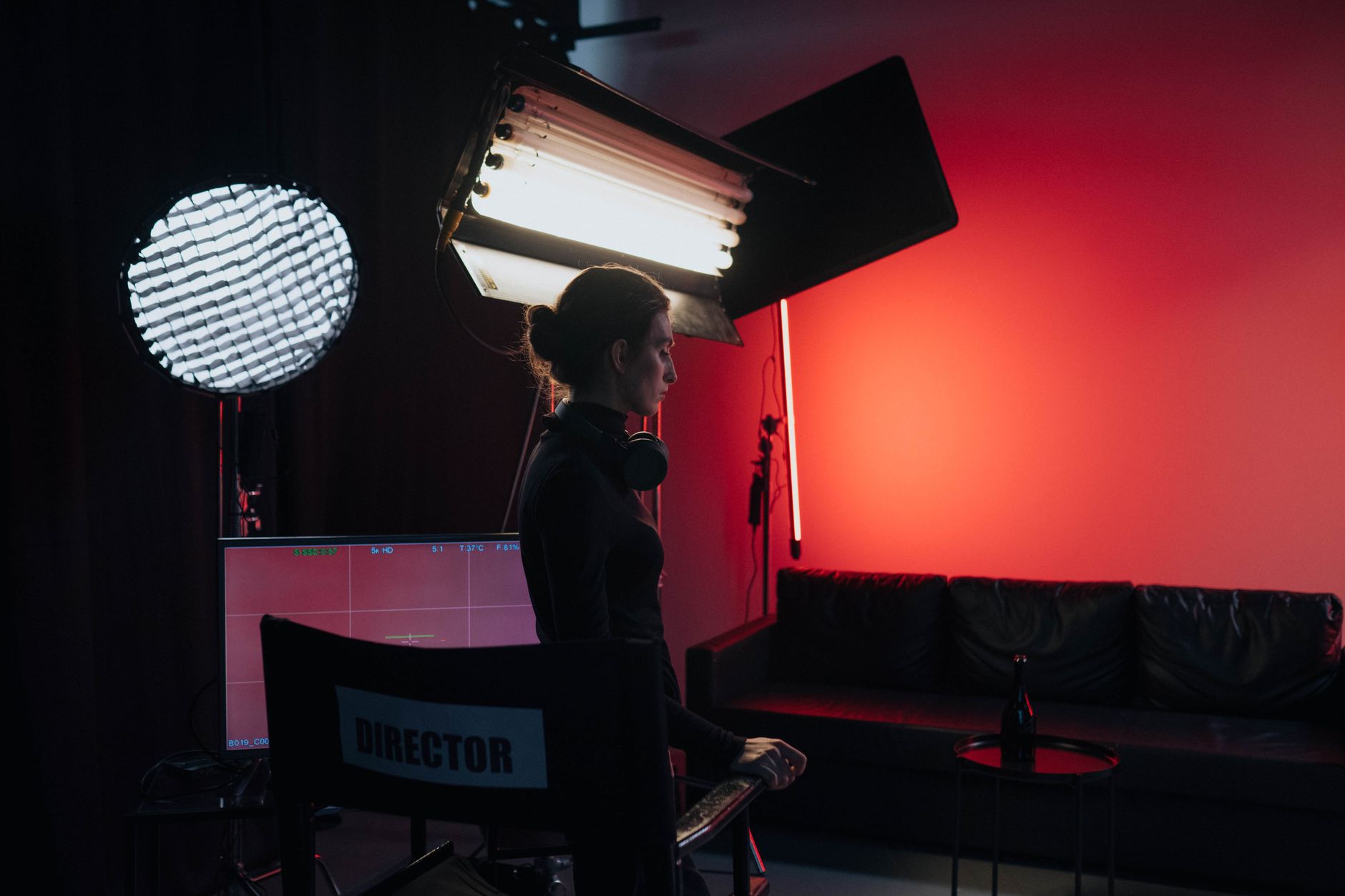 Hairstylist working on actor's hair on a television or film production set