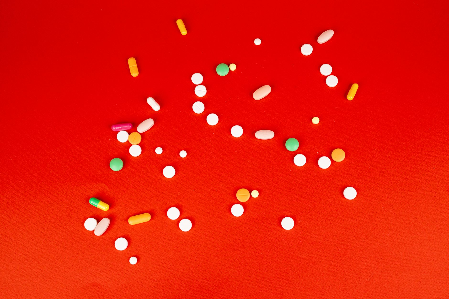 Prescription medication pills on a surface, representing GLP-1 drug treatment