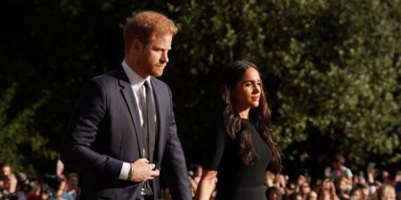 Harry and Meghan’s Possible Return to the UK Faces British Press Scrutiny Crowd of press photographers gathered outside a London building