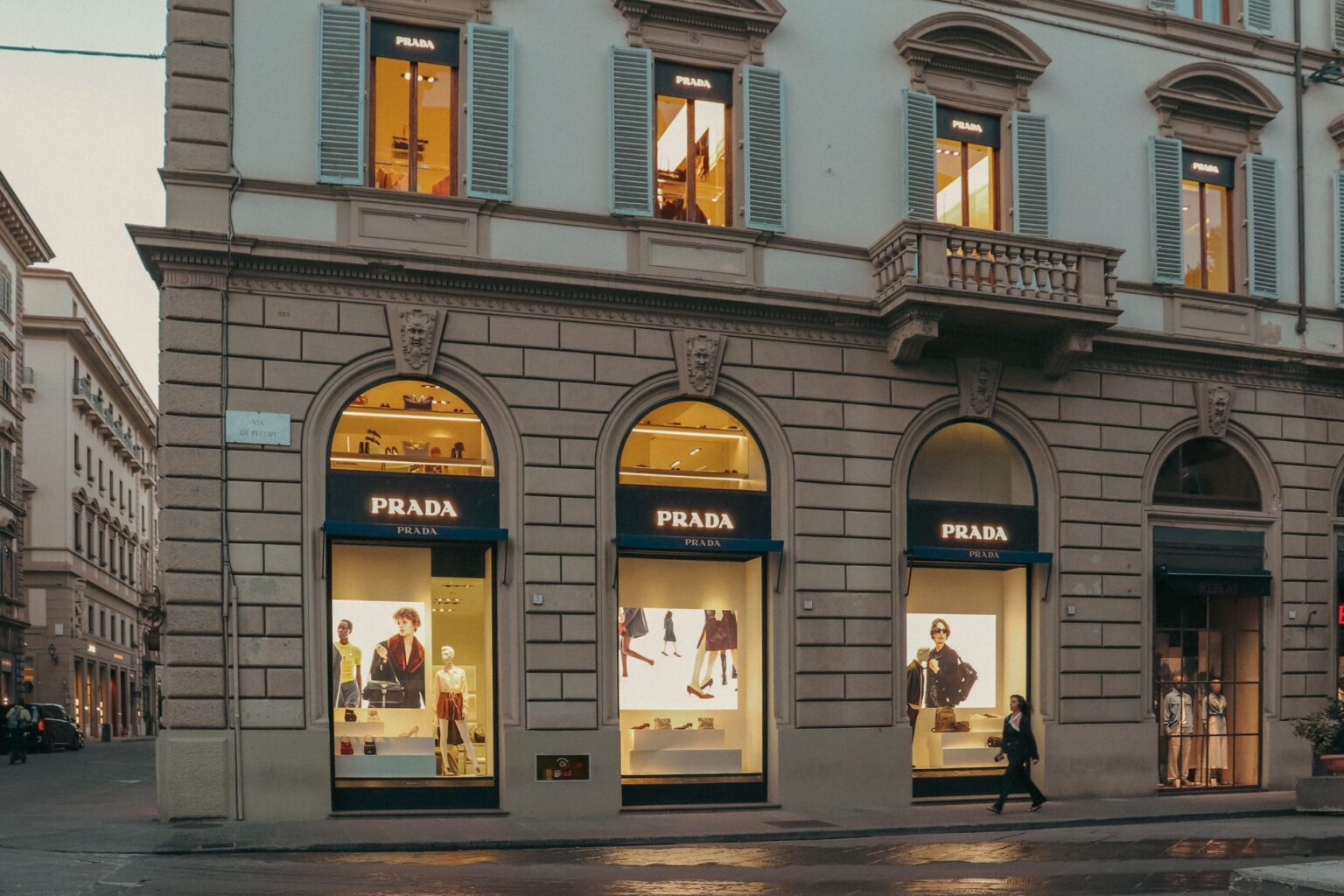 Capri Holdings Draws Acquisition Interest as Financial Obstacles Loom Interior of a high-end luxury fashion boutique with designer displays
