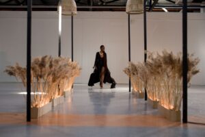 Bruno Pavlovsky Sets His Second-Term Agenda for French Fashion Models walking a Paris fashion week runway under bright stage lighting