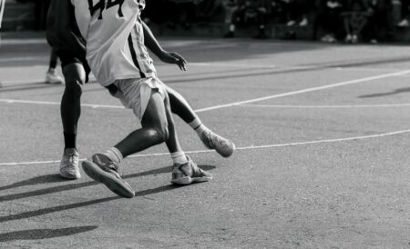 NBA 2K27 Enters the Sneaker Game With New Brands and Co-ed Play Close-up of basketball sneakers on an indoor court