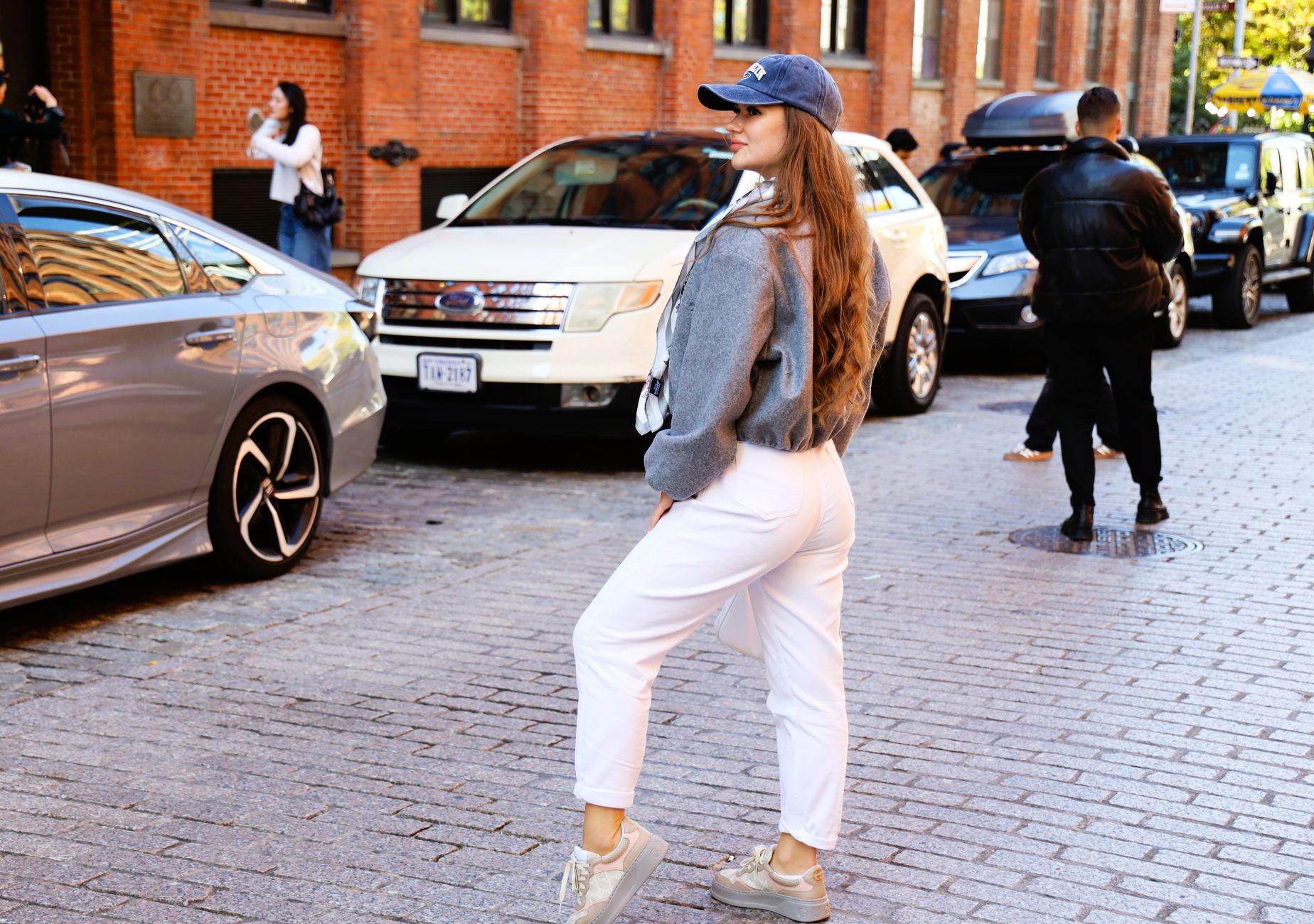 Street style fashion moment on a New York City sidewalk featuring tonal dressing
