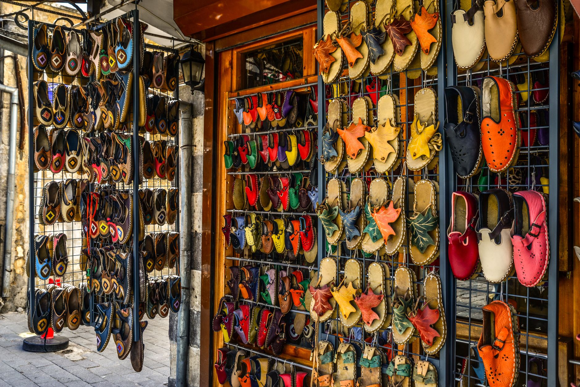 Footwear displayed on shelves in a contemporary retail environment