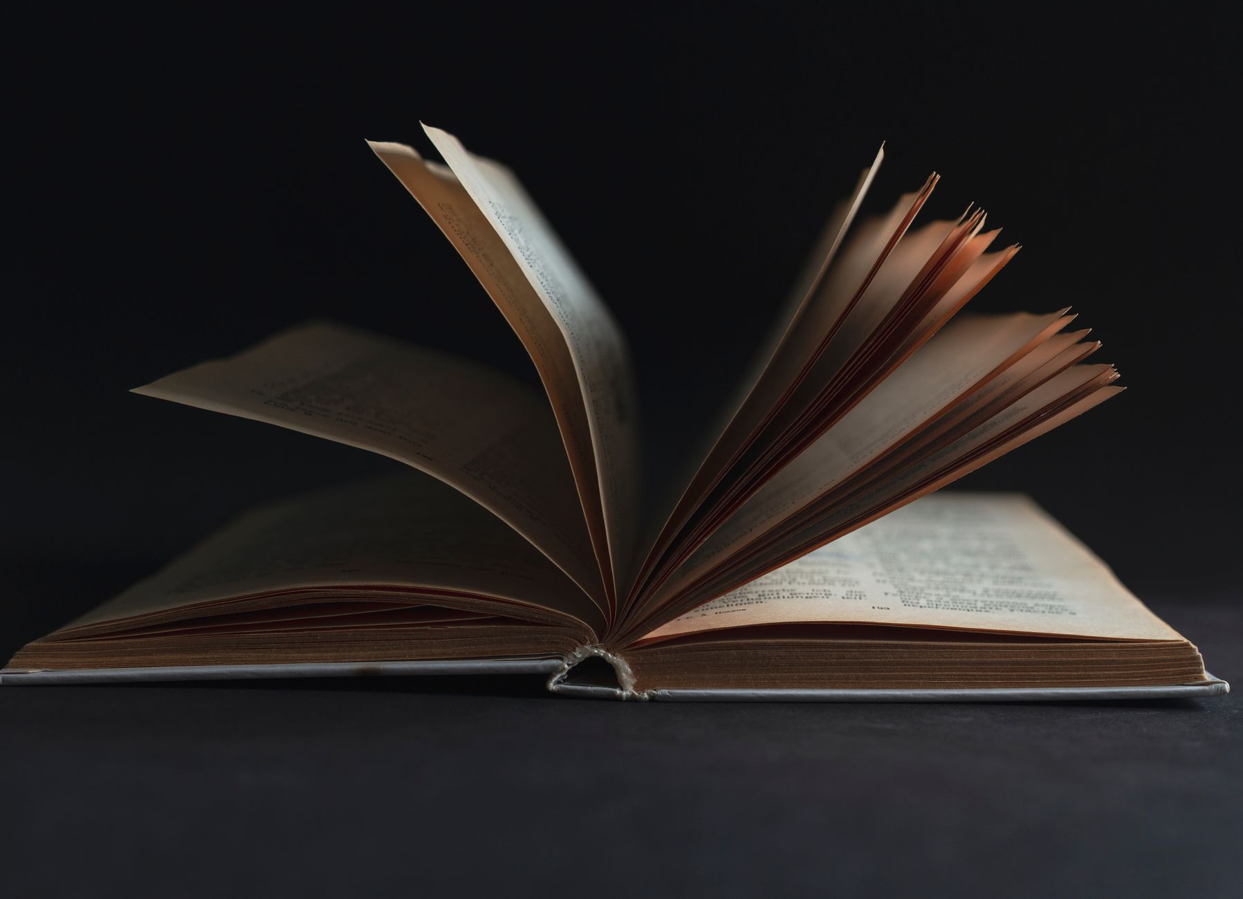 Open memoir book on a table representing personal narrative