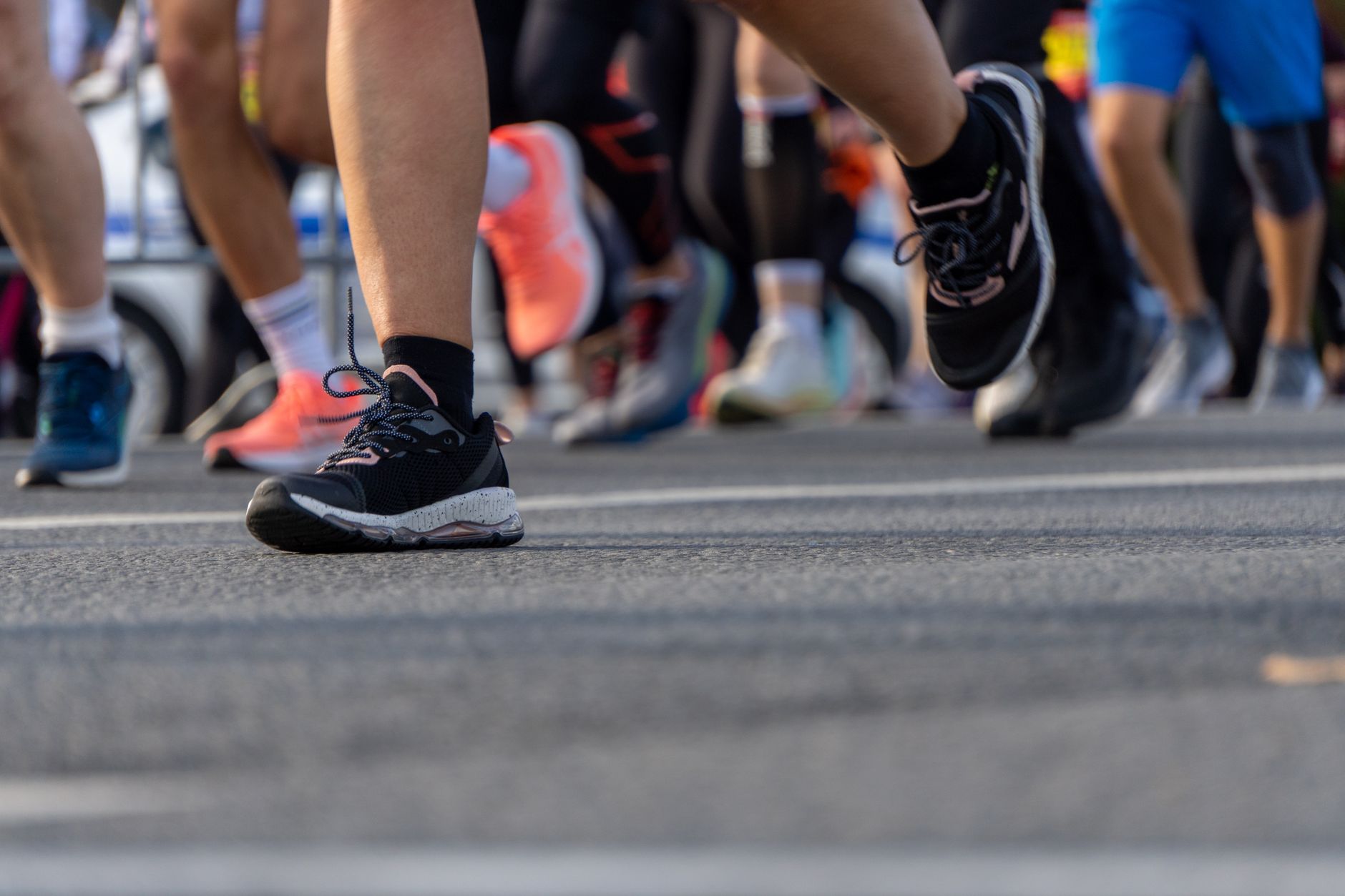 Close-up of chunky-soled performance running shoes on a clean surface