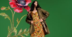 Old Navy and Altuzarra Bring Gothic Romance to a $24 Price Point A model in a dark, romantic fall outfit standing in an autumn landscape