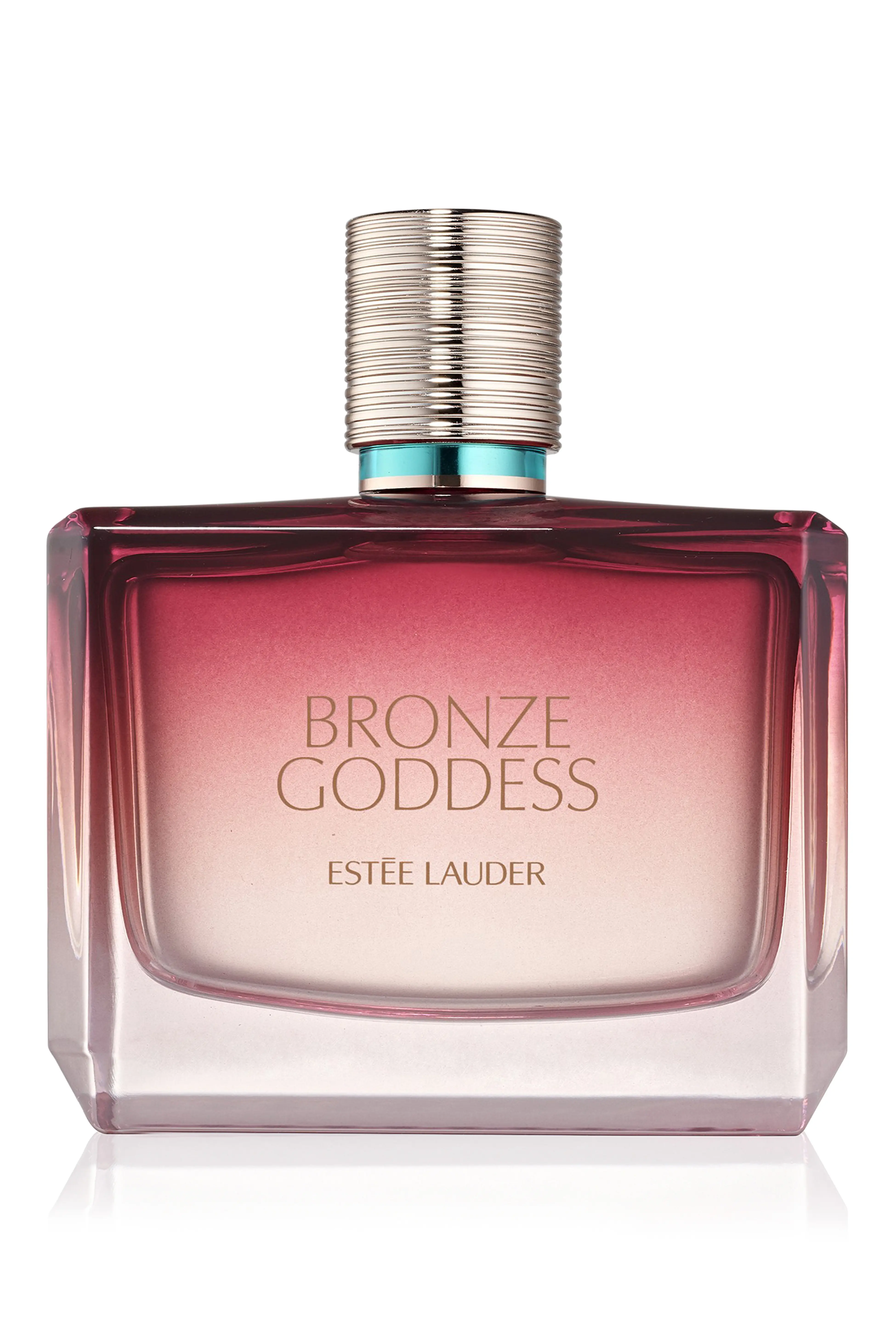 Glass perfume bottle on a wooden vanity with warm natural light