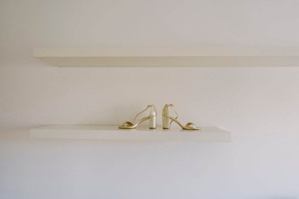 Close-up of structured heeled shoes on a display surface