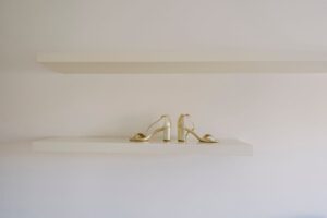 Close-up of structured heeled shoes on a display surface