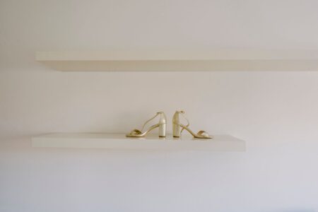 Close-up of structured heeled shoes on a display surface