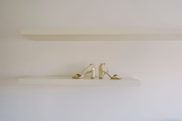 Close-up of structured heeled shoes on a display surface