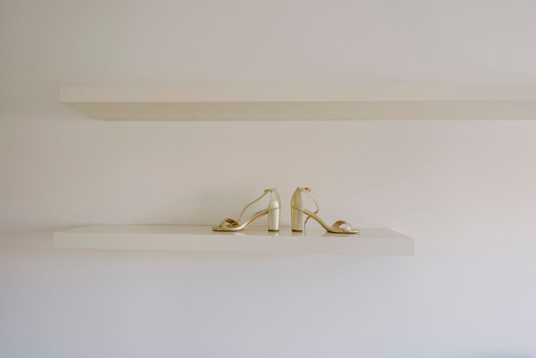 Close-up of structured heeled shoes on a display surface