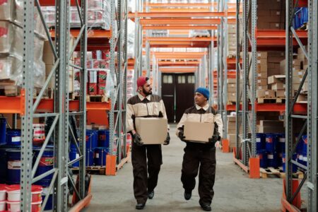 Rows of parcel boxes stacked in a shipping warehouse during peak season