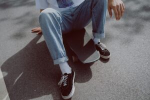 Hailey Bieber Launches New Gap Jeans Collection Available Online Now Folded baggy denim jeans in a retail setting