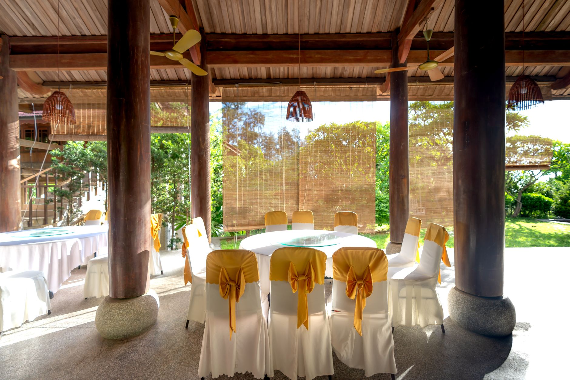 Couple dining at an outdoor resort restaurant at sunset