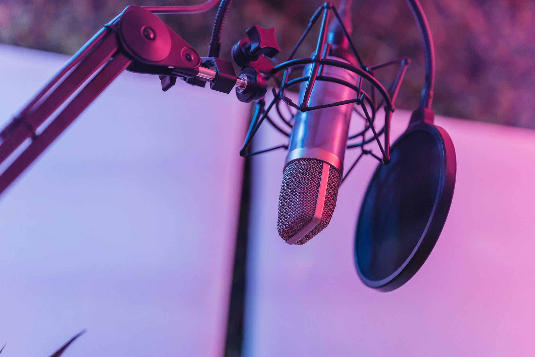 A microphone set up in a recording studio for a podcast conversation