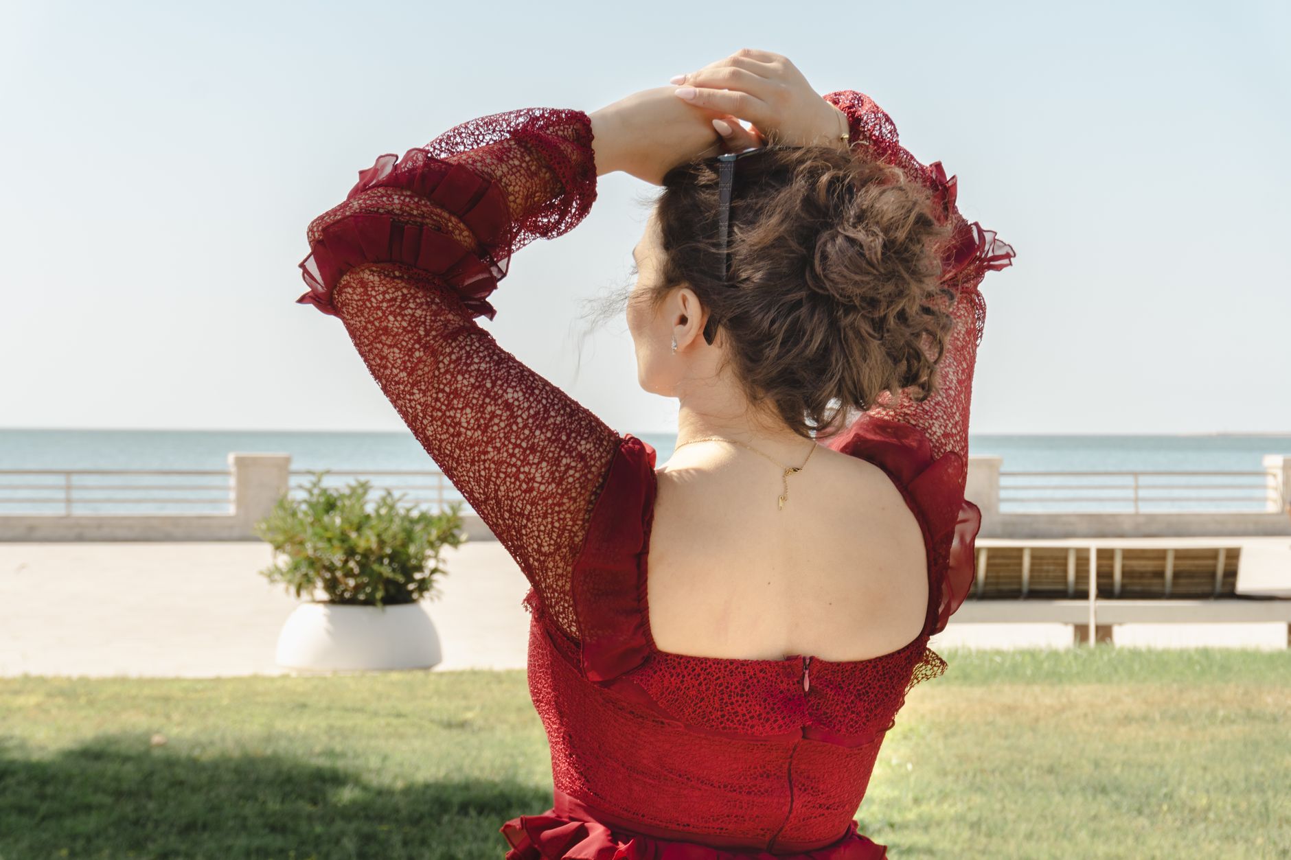 Woman wearing a structured updo crown hairstyle in profile view