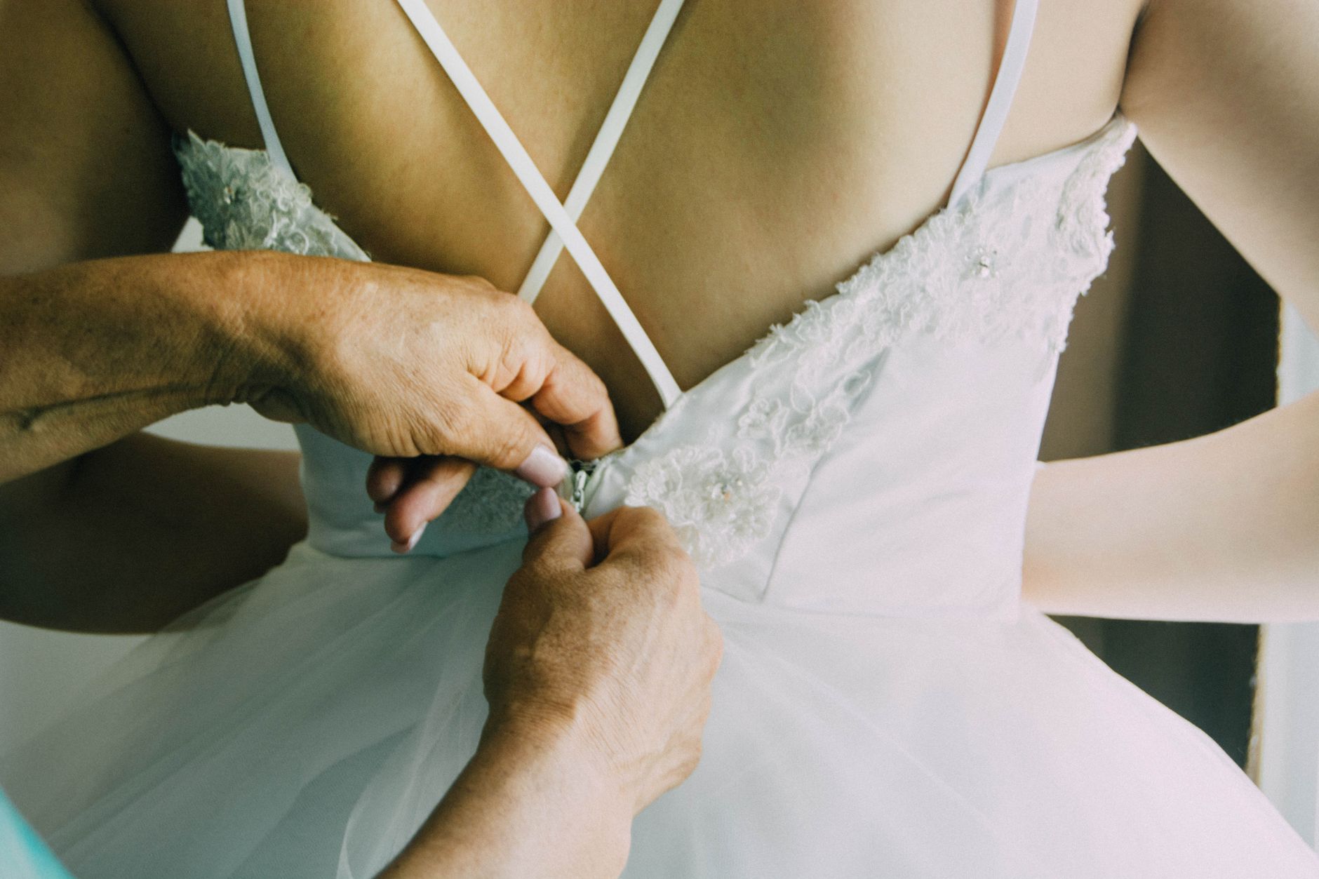 Close-up of intricate fabric detail on a formal evening gown
