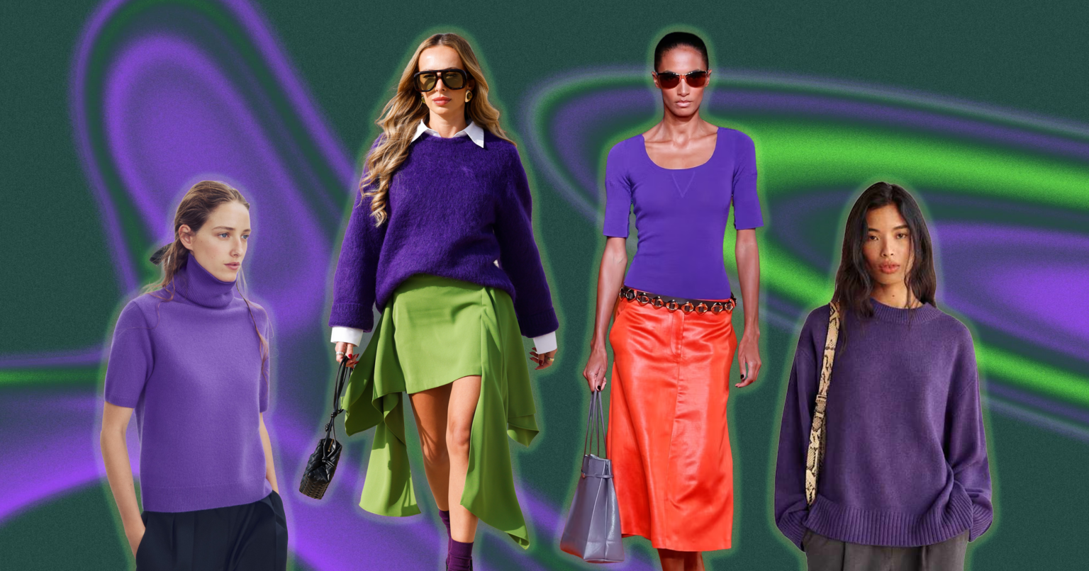A folded deep purple knit sweater on a neutral background