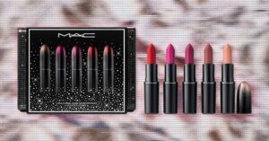Assorted holiday beauty gift sets arranged on a festive background