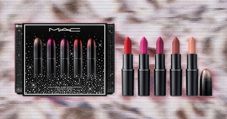 Assorted holiday beauty gift sets arranged on a festive background