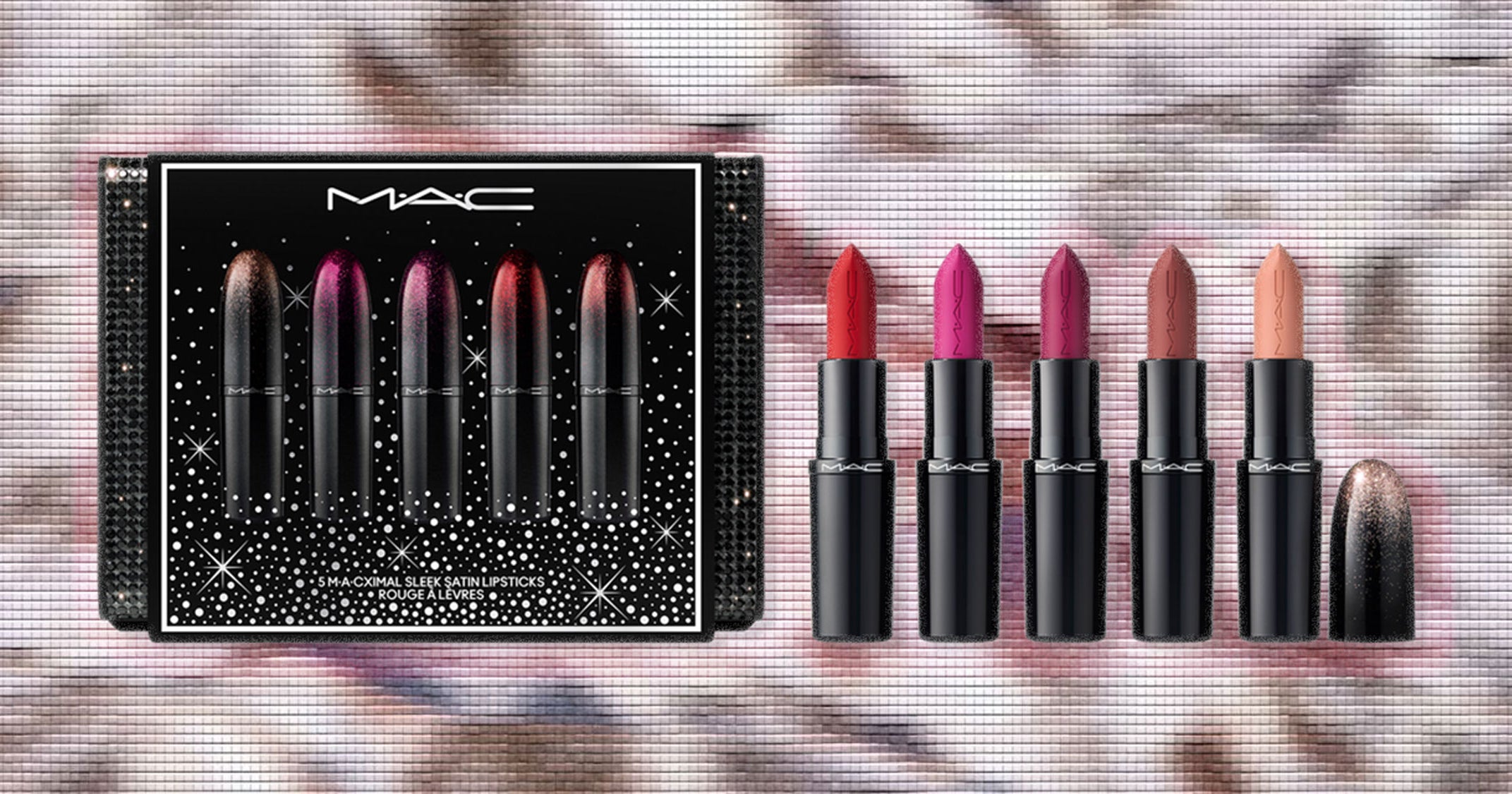 Assorted holiday beauty gift sets arranged on a festive background
