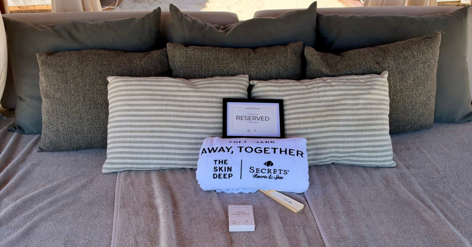 Conversation Cards Are the Best Way to Bond While Traveling Couple sitting on a beach talking during vacation