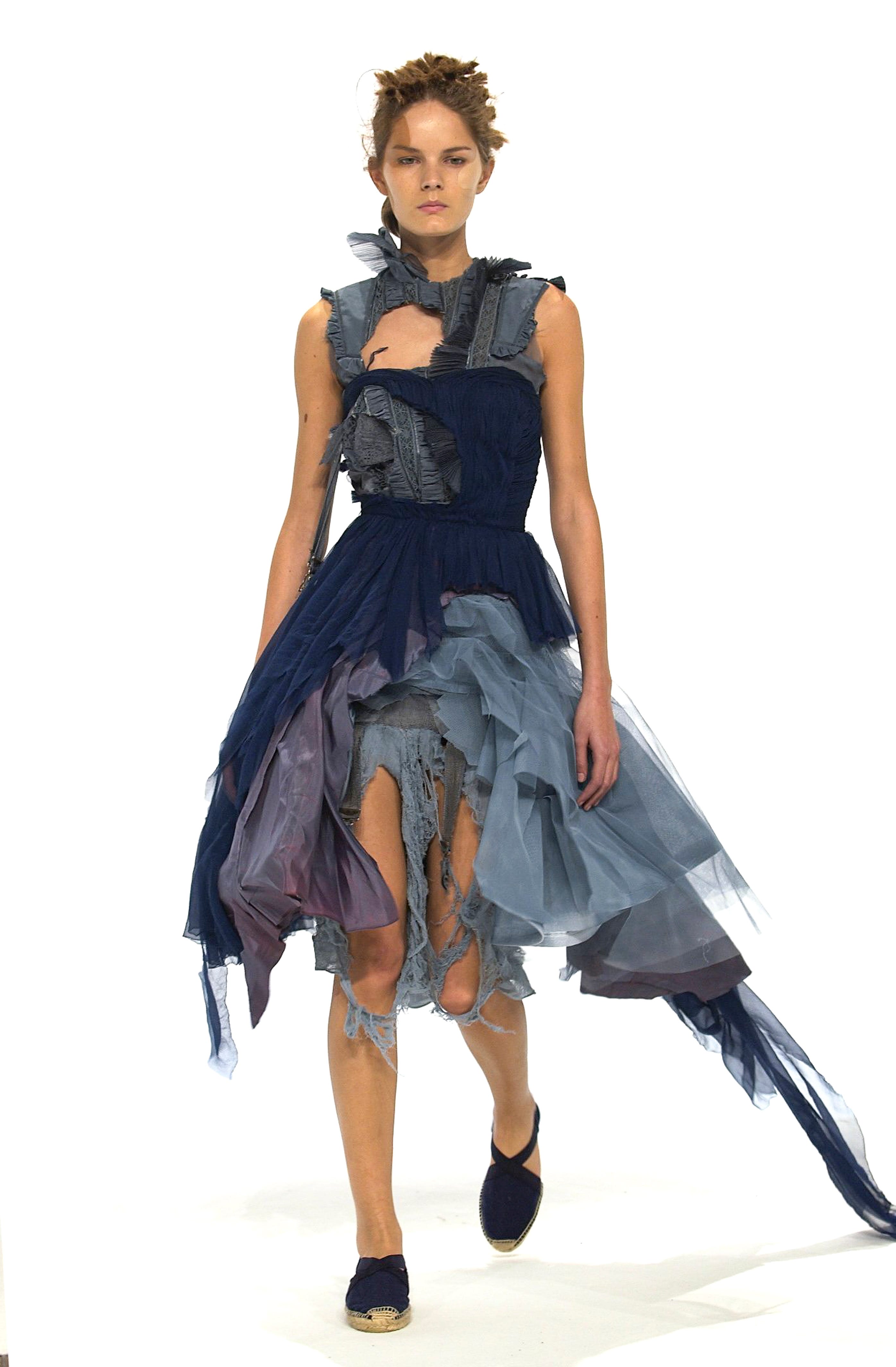 Editorial fashion portrait with dramatic lighting and structured garment